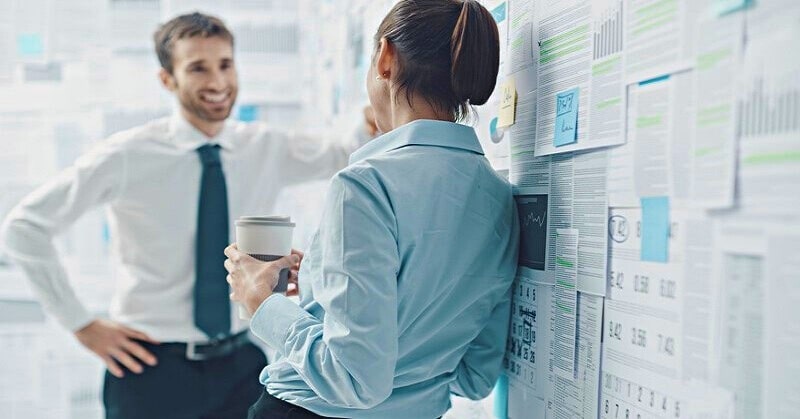 male and female coworkers flirting illustrating a husband who has fallen in love with another woman