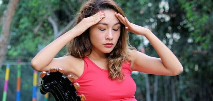 stressed out woman who is doing too much