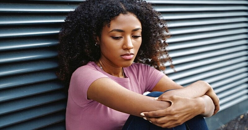 young African American woman looking low in self-confidence