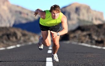 competitive man running on road