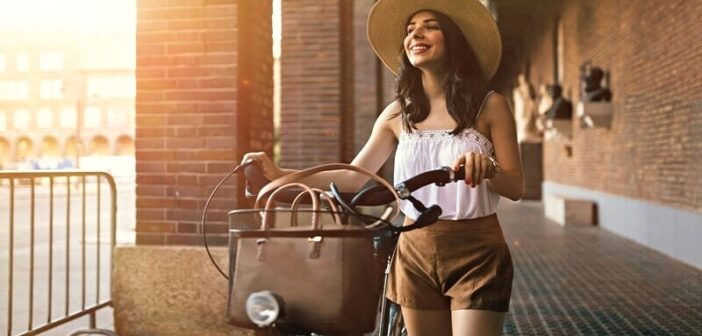 young woman with bike enjoying her own company