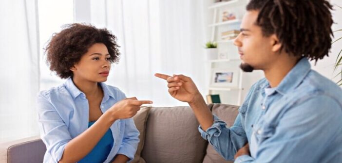 couple pointing fingers at each other illustrating nitpicking in a relationship
