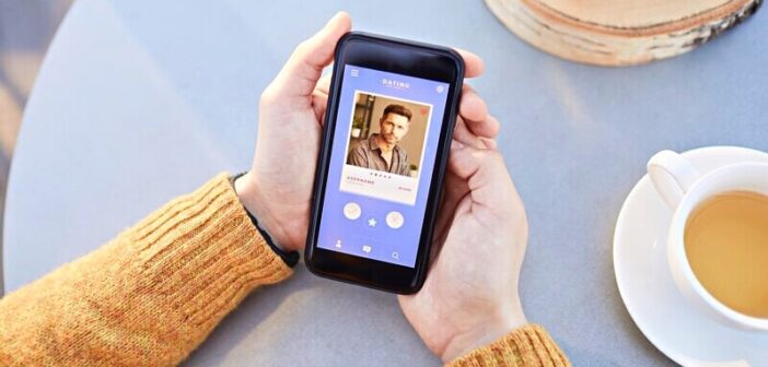 woman holding a phone using a dating app