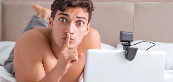 shirtless man doing shush pose with his finger illustrating a red flag for online dating
