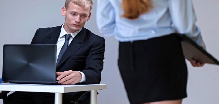 perverted man ogling his female coworker