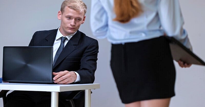 perverted man ogling his female coworker