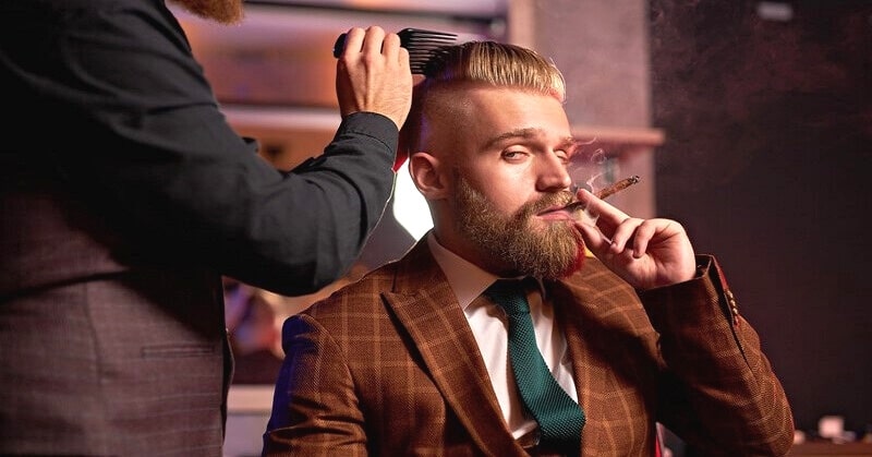 spoiled man smoking cigar at barber