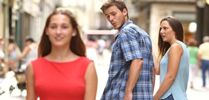 boyfriend looking at another woman on the street