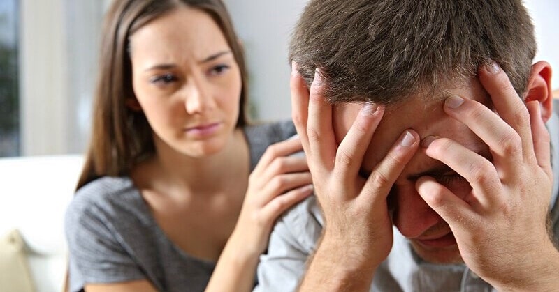 woman consoling sad man - staying with him out of guilt