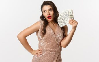 woman showing off with a hand full of cash