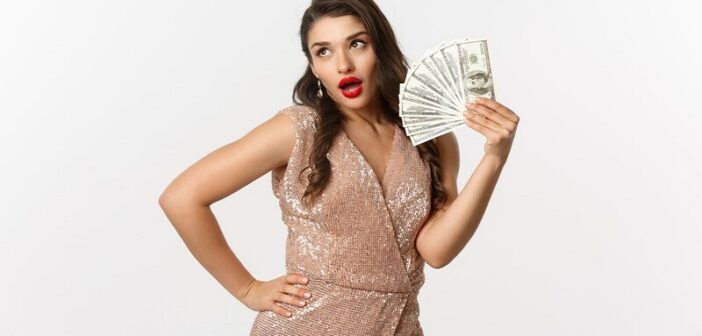 woman showing off with a hand full of cash