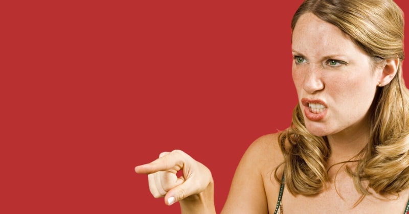 angry woman pointing finger and looking mean
