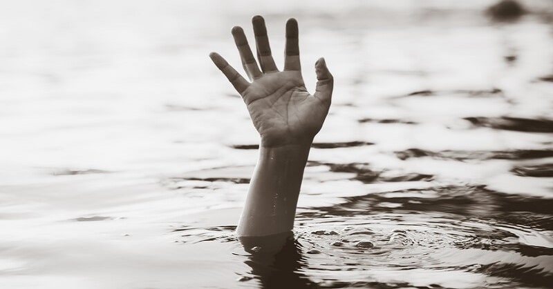 hand of drowning person coming out of water