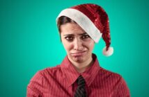 woman who hates Christmas wearing a Santa hat