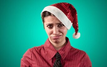 woman who hates Christmas wearing a Santa hat