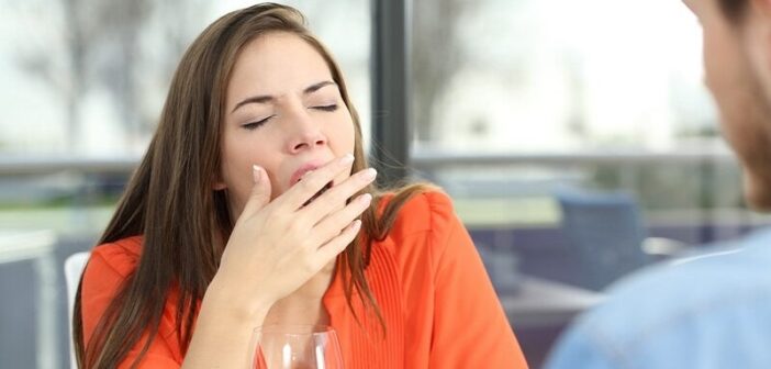 woman yawning on date
