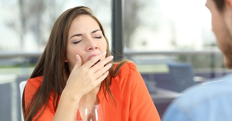 woman yawning on date