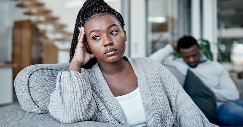 woman looking unhappy because her husband forgot their anniversary