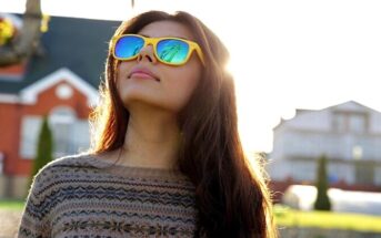 cool young woman with quirky yellow sunglasses