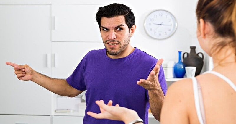 couple arguing - man pointing away illustrating deflection