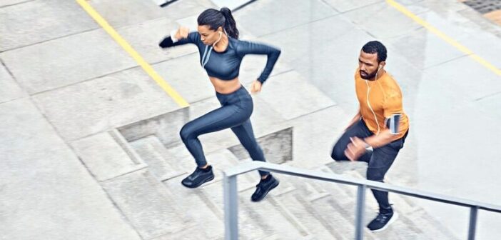 man and woman running up steps outside - illustrating disciplined people