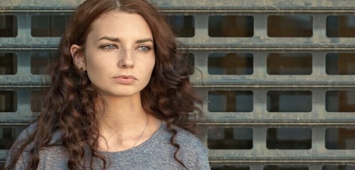 emotional permanence illustrated by image of a young woman looking pensive