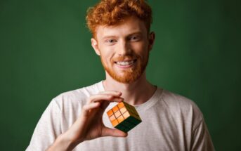 man who is a good problem-solver holding a Rubik's Cube