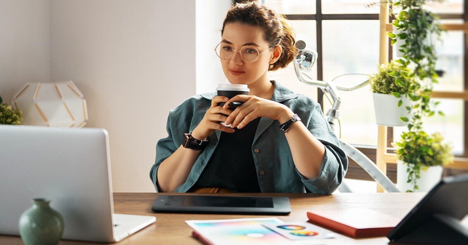 young woman working alone in her home office