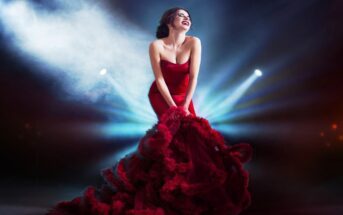 woman in striking red dress standing in several spotlights - illustrating an attention-seeker