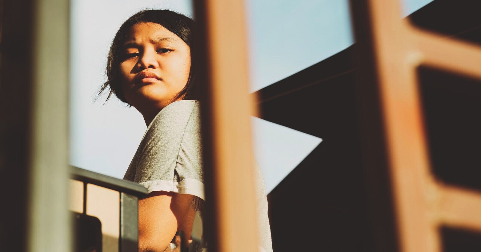 low angle view of a young discontent woman