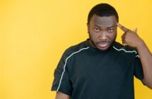 “People Think I’m Stupid” (7 Things You Can Do) man pointing his finger to his head as if to say "are you stupid?"