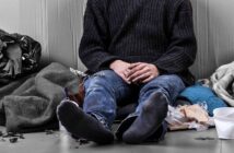 What I Learned About Life From Being Homeless (15 Lessons) homeless person from the neck down sitting on the floor surrounded by his possessions