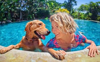 smiling woman in her 40s in a swimming pool with her dog - illustrating picking herself up after divorce