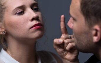 woman who is speaking to her partner in a controlling way and pointing her finger