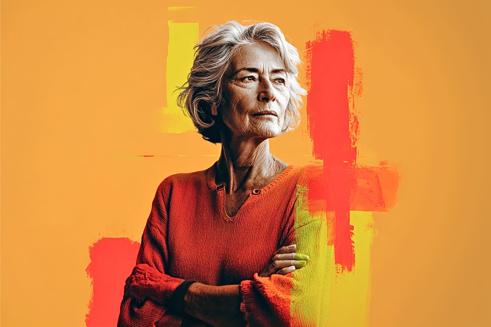 An older woman with gray hair and a thoughtful expression stands with arms crossed, wearing an orange sweater, against an orange background with abstract red and yellow brushstrokes.