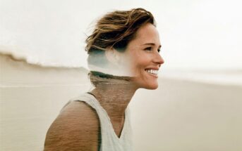 A smiling woman with short brown hair stands outdoors, overlaid with a double exposure effect of a serene beach scene.