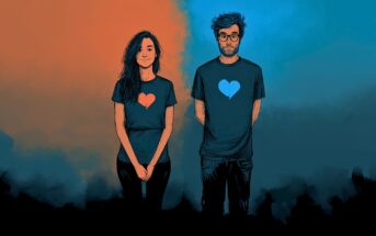 A woman and man stand side by side against a split orange and blue background. Each wears a shirt with a heart graphic that matches the opposite side’s color—orange on hers, blue on his. Both have neutral expressions.