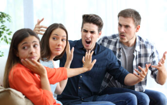 Four people sitting on a couch express intense emotions. The person on the left appears upset, the second person gestures defensively, the third person shouts angrily, and the fourth person argues passionately.