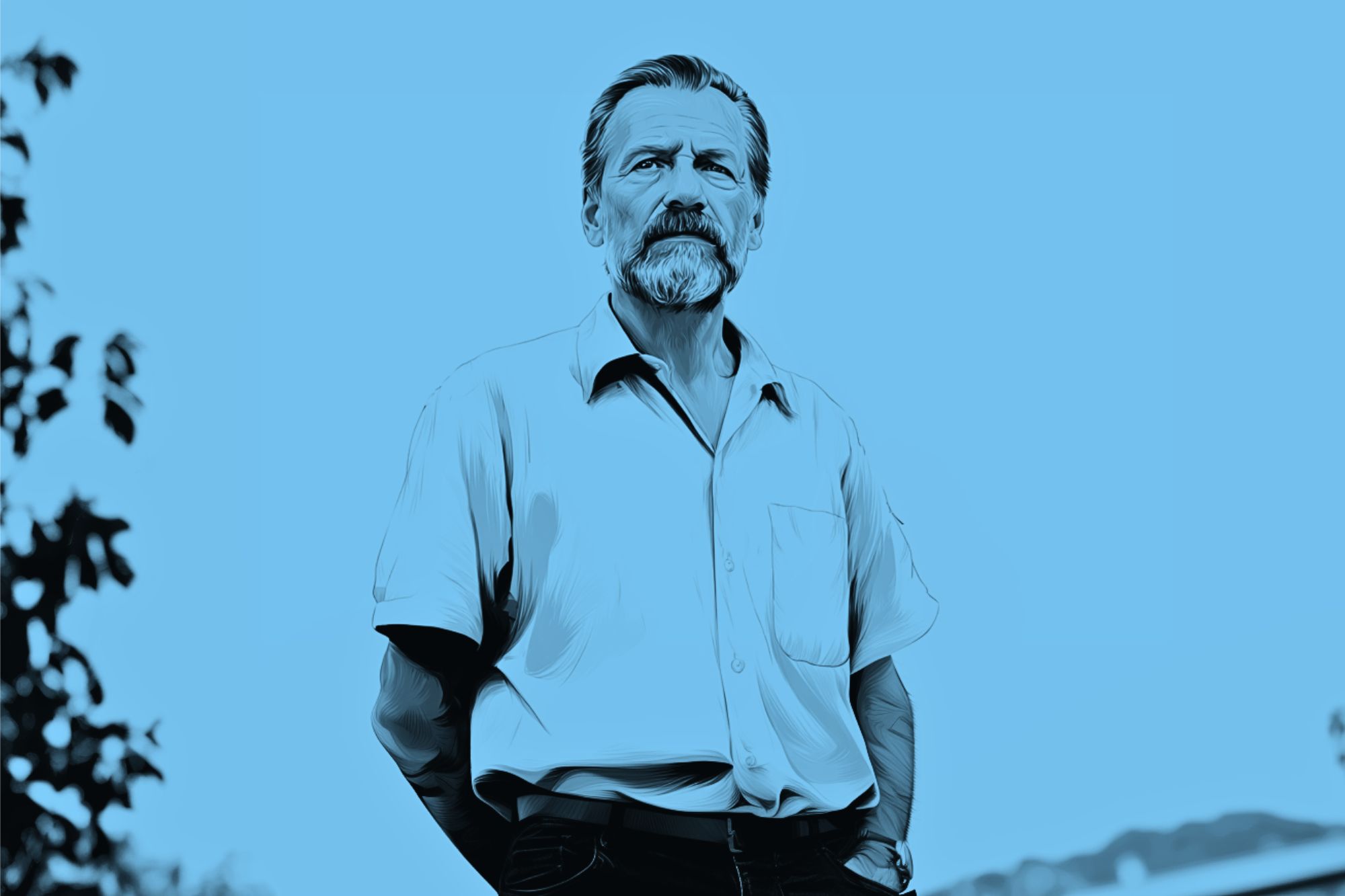 A man with a mustache and beard stands outdoors, wearing a short-sleeve button-up shirt. The image has a blue filter and some trees are visible in the background.