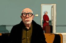 An elderly man with glasses sits on a couch looking ahead, while an elderly woman in a red dress stands by a doorway holding a suitcase, appearing as if she is about to leave. The room has muted blue-green walls.