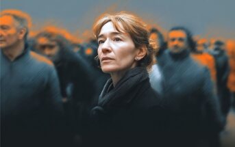 A woman with light brown hair and a black scarf looks upward with a thoughtful expression, standing among a blurred crowd of people against a gray background with orange highlights.