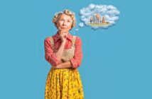 An older woman in a colorful apron and yellow floral skirt stands thoughtfully with her hand on her chin, while a cloud-shaped thought bubble above her shows a family standing together.