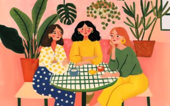 Three women sit around a green-checkered table with drinks, surrounded by large potted plants. They wear colorful clothes and appear to be chatting in a cozy, pink-themed setting.