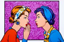Two women in colorful, retro-style clothing and headscarves face each other. One whispers into the other's ear against a vibrant purple, patterned background, evoking a pop art comic book style.