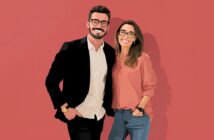 An illustrated image of a smiling man in a black suit and a woman in a pink blouse and jeans, both wearing glasses, standing together against a solid pink background.