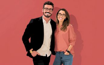 An illustrated image of a smiling man in a black suit and a woman in a pink blouse and jeans, both wearing glasses, standing together against a solid pink background.