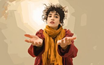 A person with curly hair, wearing a red coat and mustard yellow scarf, stands with arms outstretched and palms open, looking directly ahead against a neutral background.