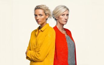 Two women stand back to back against a plain background. One is younger with blonde hair, wearing a yellow shirt; the other is older with light hair in a bun, wearing a red cardigan over a patterned top. Both have serious expressions.