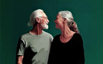 An elderly man and woman with gray hair smile warmly at each other against a green background.