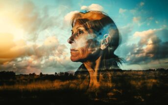 A double exposure image shows an older woman’s thoughtful face blended with a dramatic sky, clouds, and a sunlit field, evoking a sense of reflection and connection with nature.